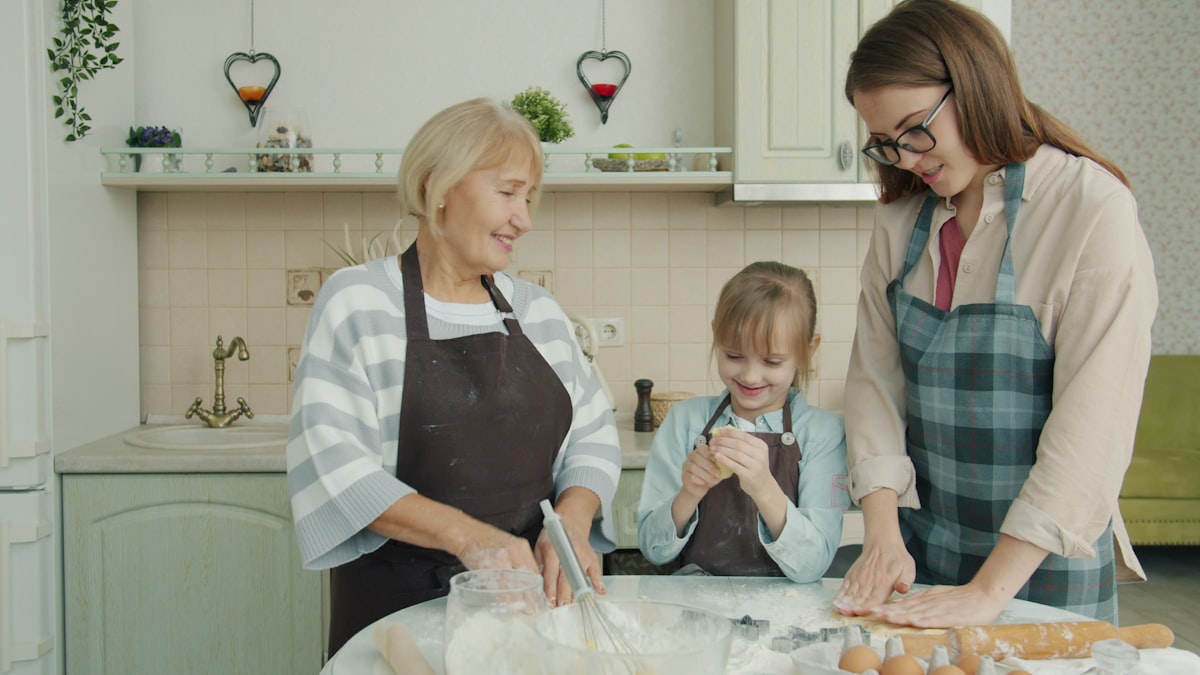 Family cooking together in a bright kitchen